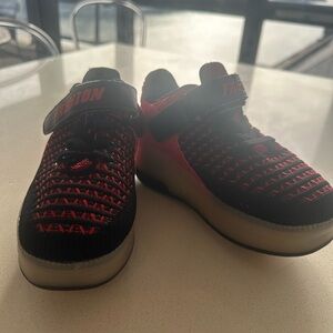 Kids wheeled sneakers, red and black